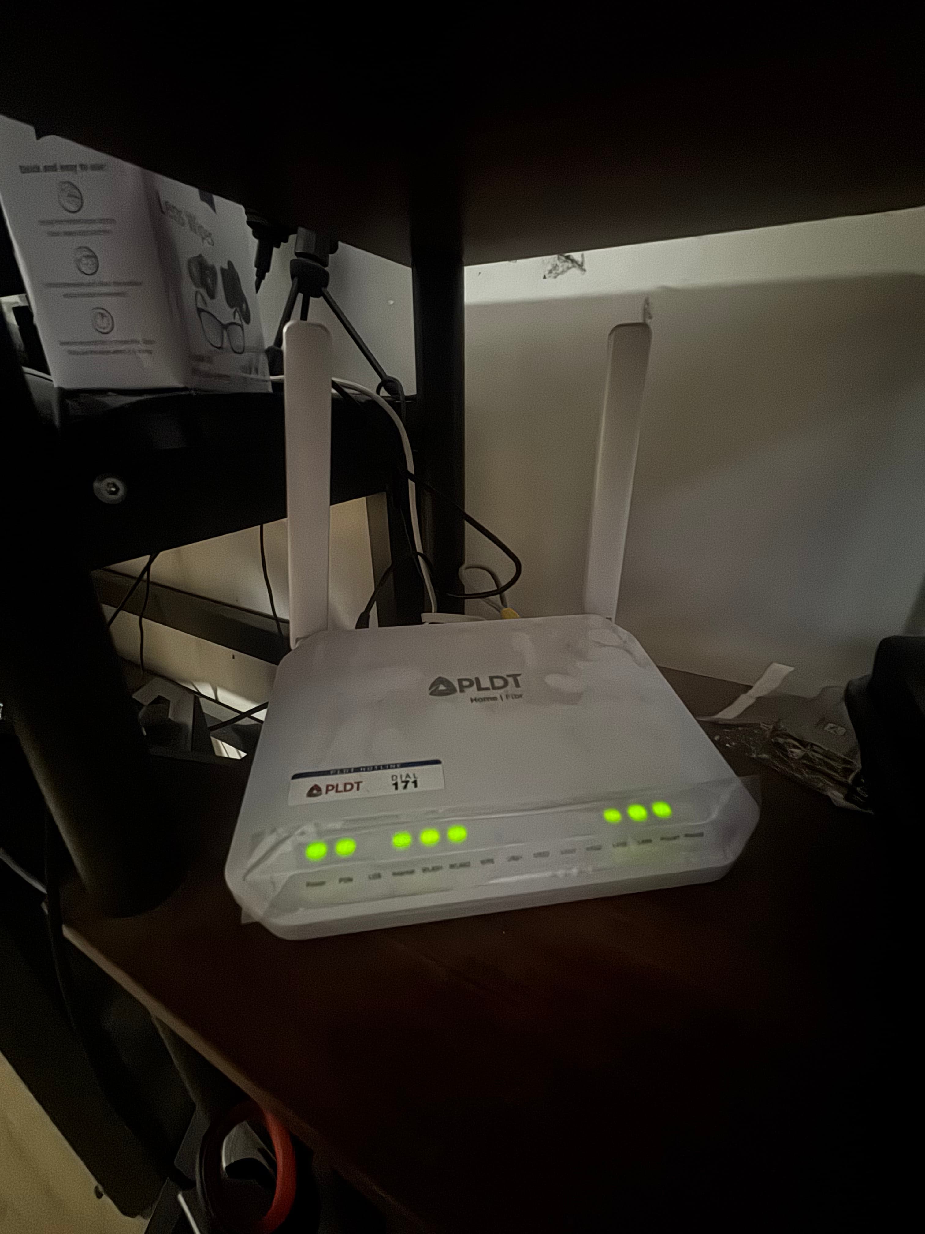 PLDT Home Fibre router with two antennas and a row of steady green status lights